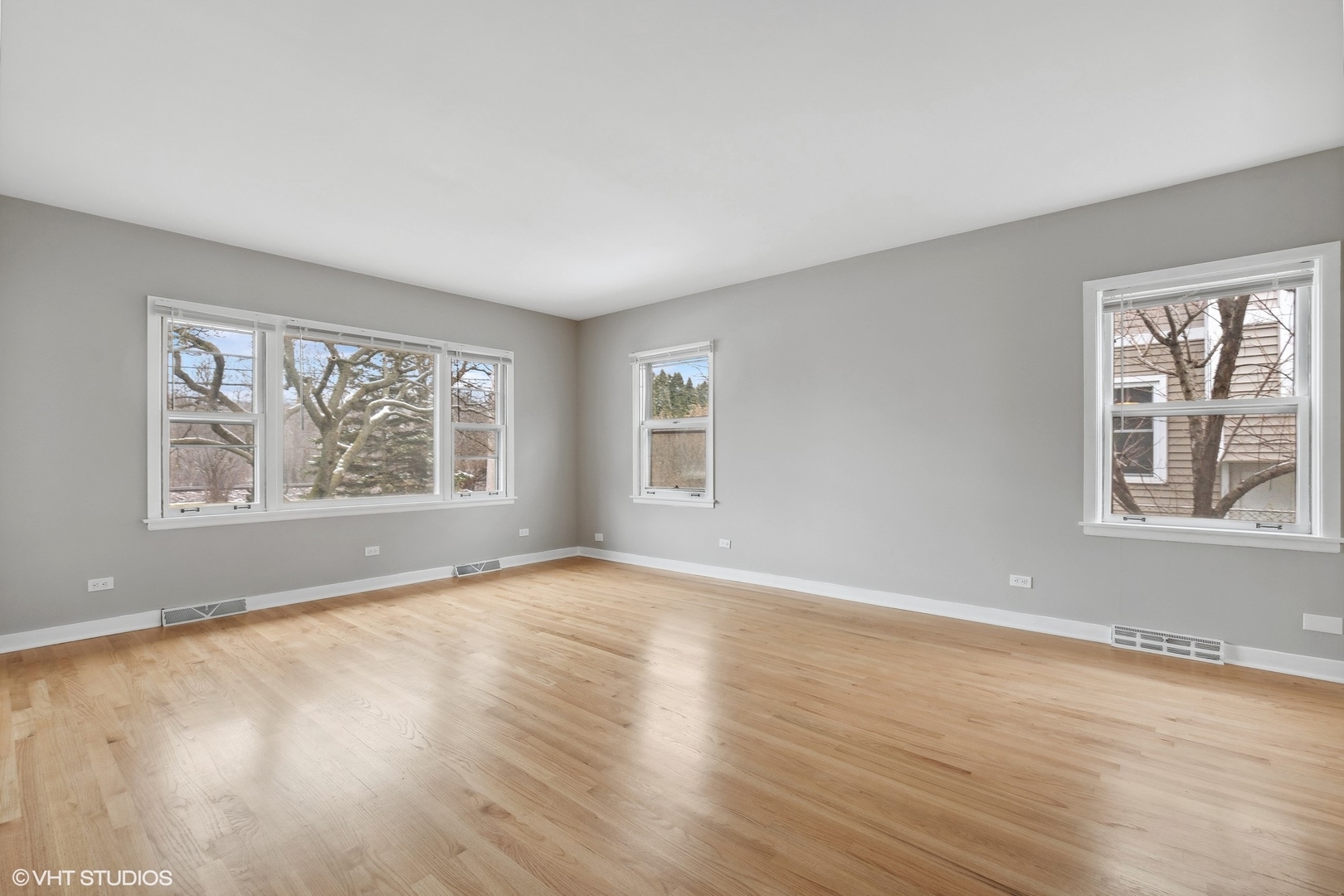2490 Green Bay Road Highland Park, IL 60035 - Photo 9 of 29 a view of an empty room with a window and wooden floor