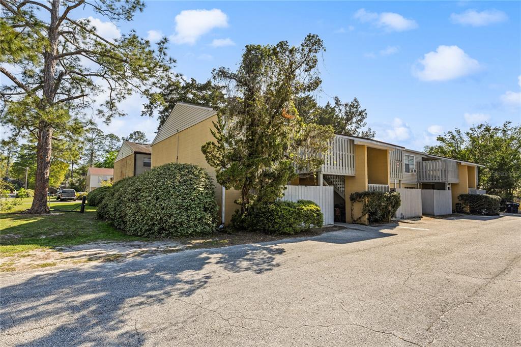3904 Southwest 26th Drive, Unit B Gainesville, FL 32608 - Photo 1 of 1 a view of a house with a yard and pathway