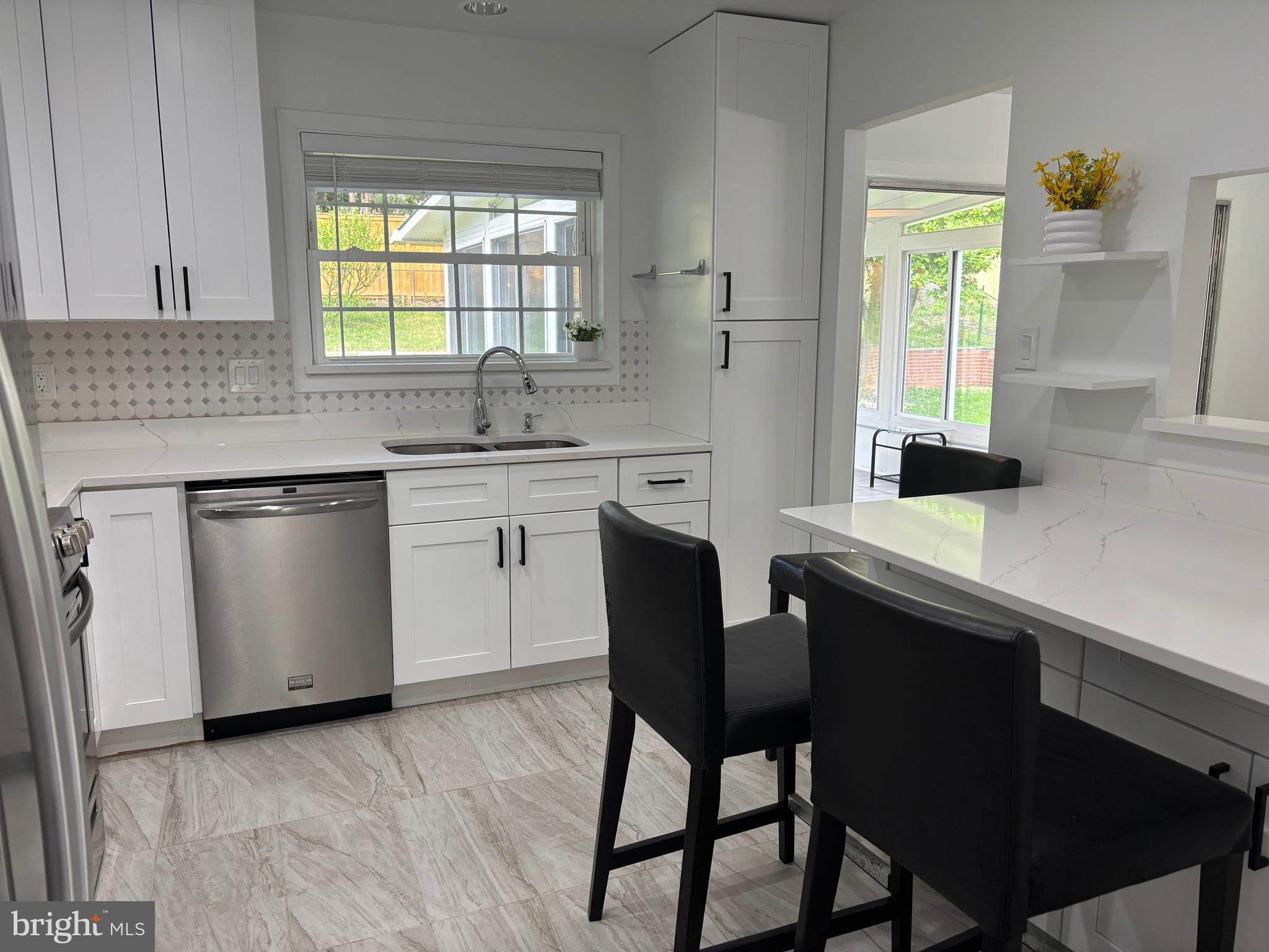 10310 Royal Road Silver Spring, MD 20903 - Photo 19 of 61 a kitchen with a sink stove and cabinets