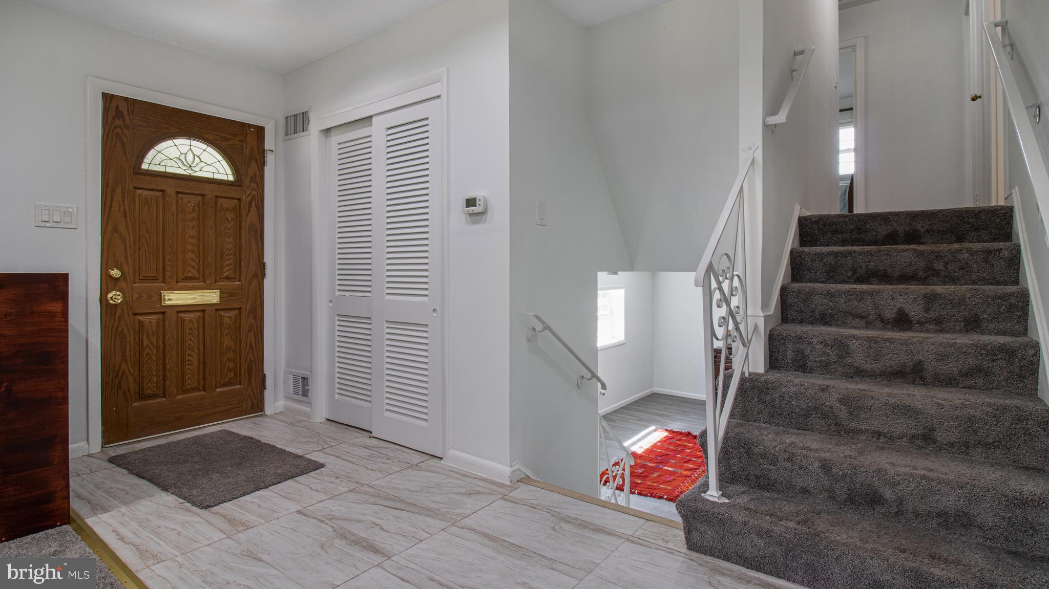 10310 Royal Road Silver Spring, MD 20903 - Photo 23 of 61 a view of entryway and hall with wooden floor