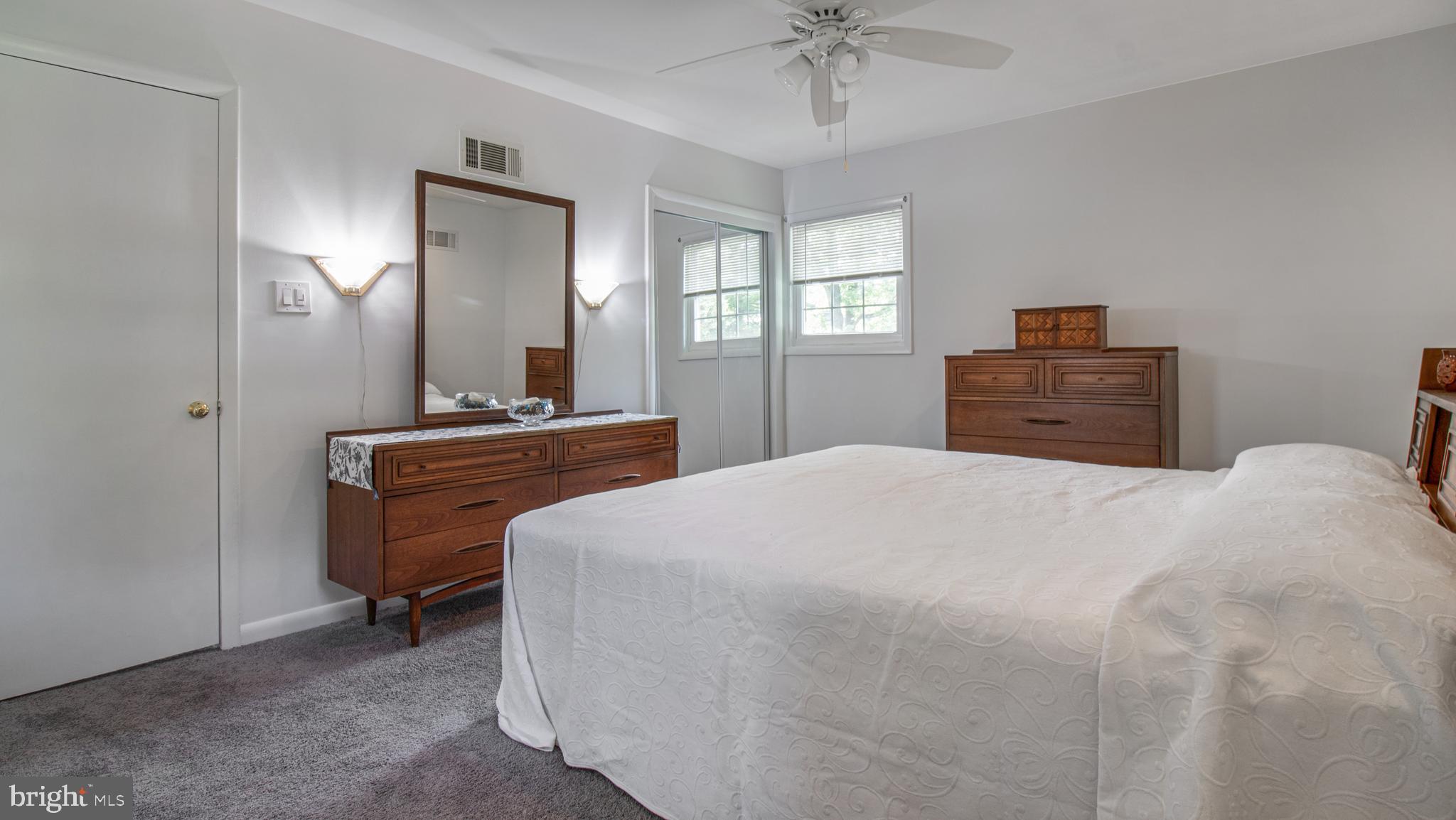 10310 Royal Road Silver Spring, MD 20903 - Photo 26 of 61 a bedroom with a bed and a chandelier