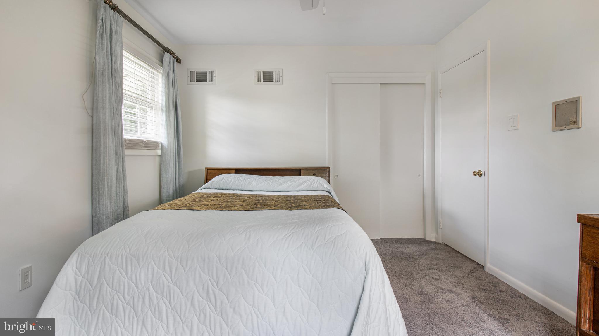 10310 Royal Road Silver Spring, MD 20903 - Photo 30 of 61 a bedroom with a bed and a window