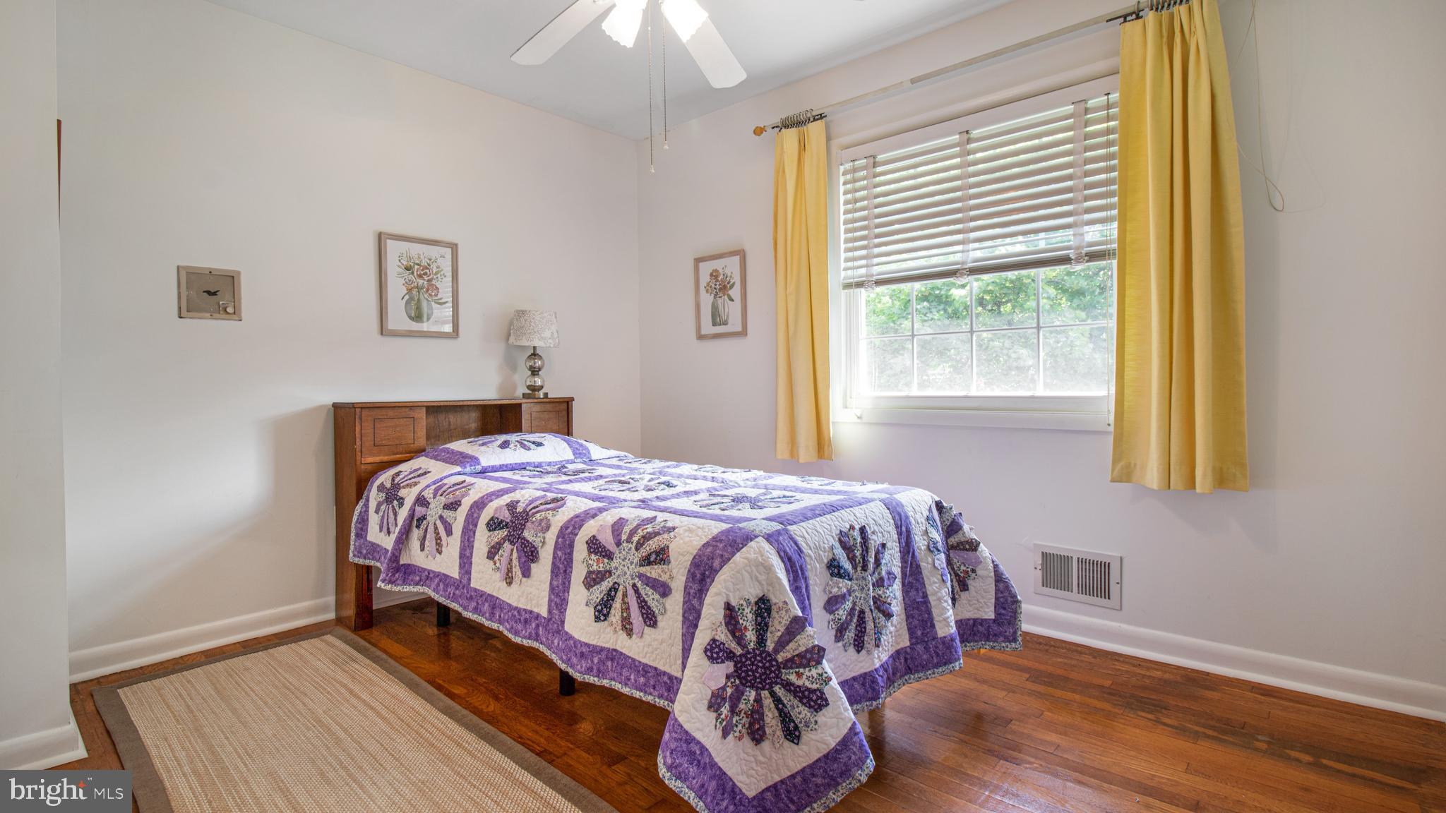 10310 Royal Road Silver Spring, MD 20903 - Photo 31 of 61 a bedroom with a bed and a window
