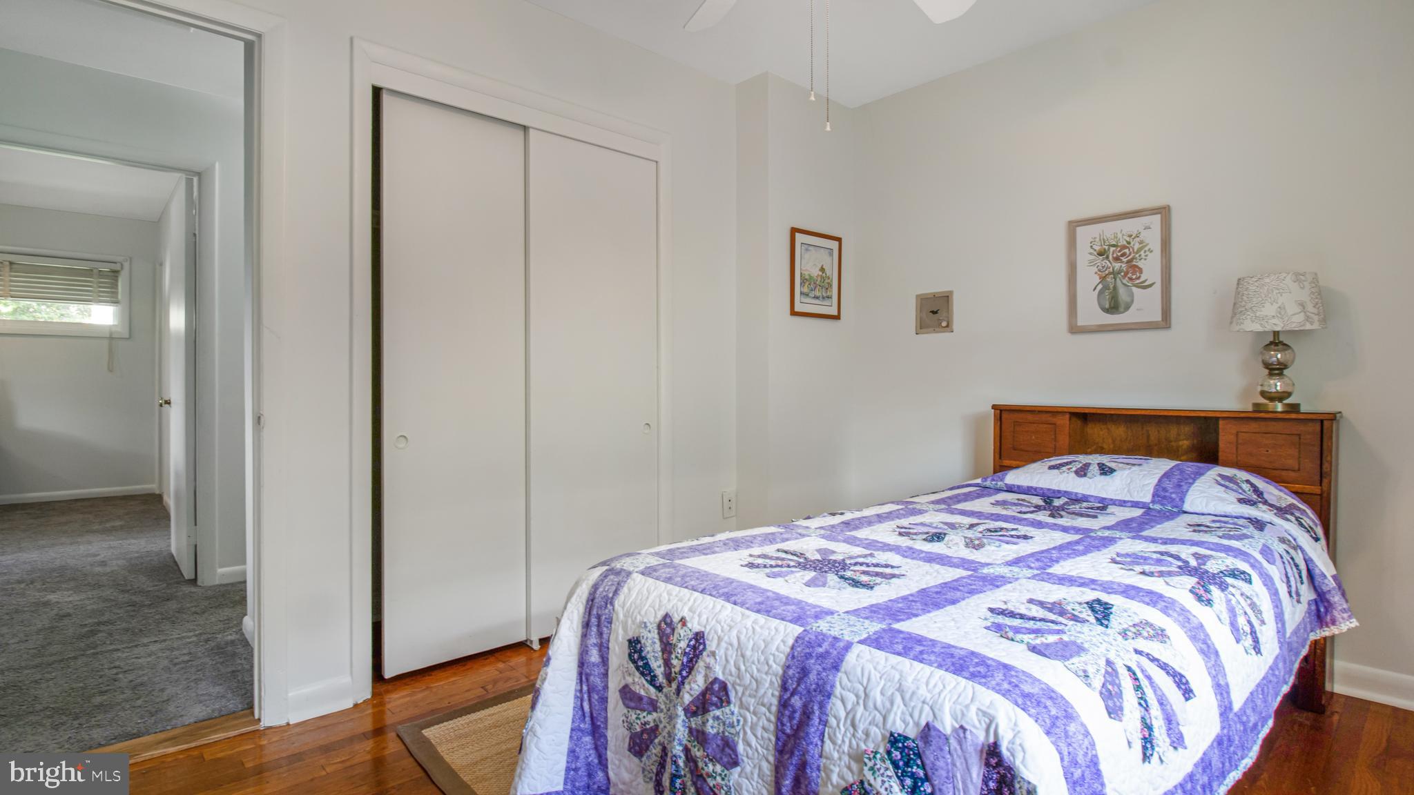 10310 Royal Road Silver Spring, MD 20903 - Photo 32 of 61 a bedroom with a bed and hallway