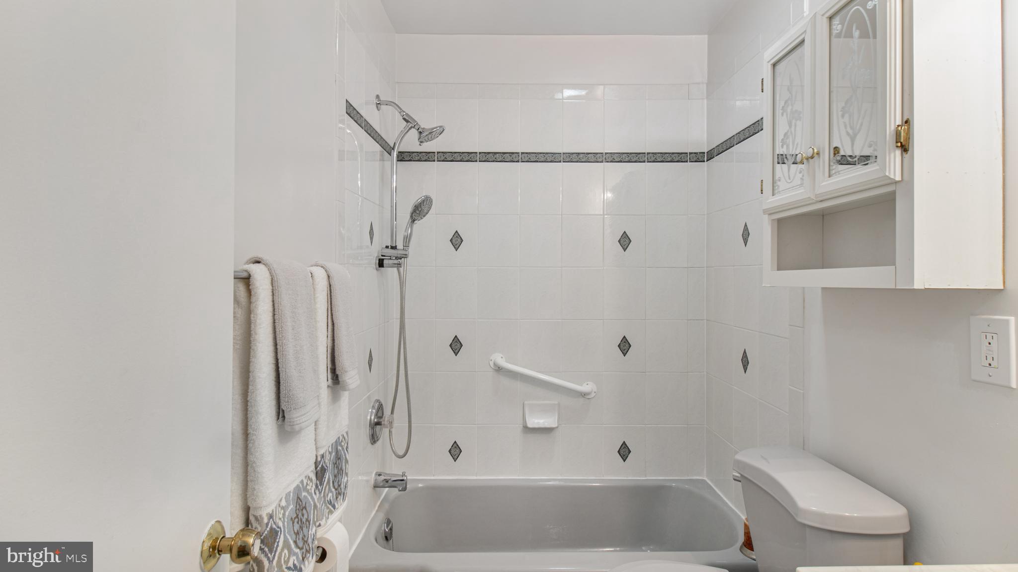 10310 Royal Road Silver Spring, MD 20903 - Photo 33 of 61 a bathroom with a bathtub and a shower