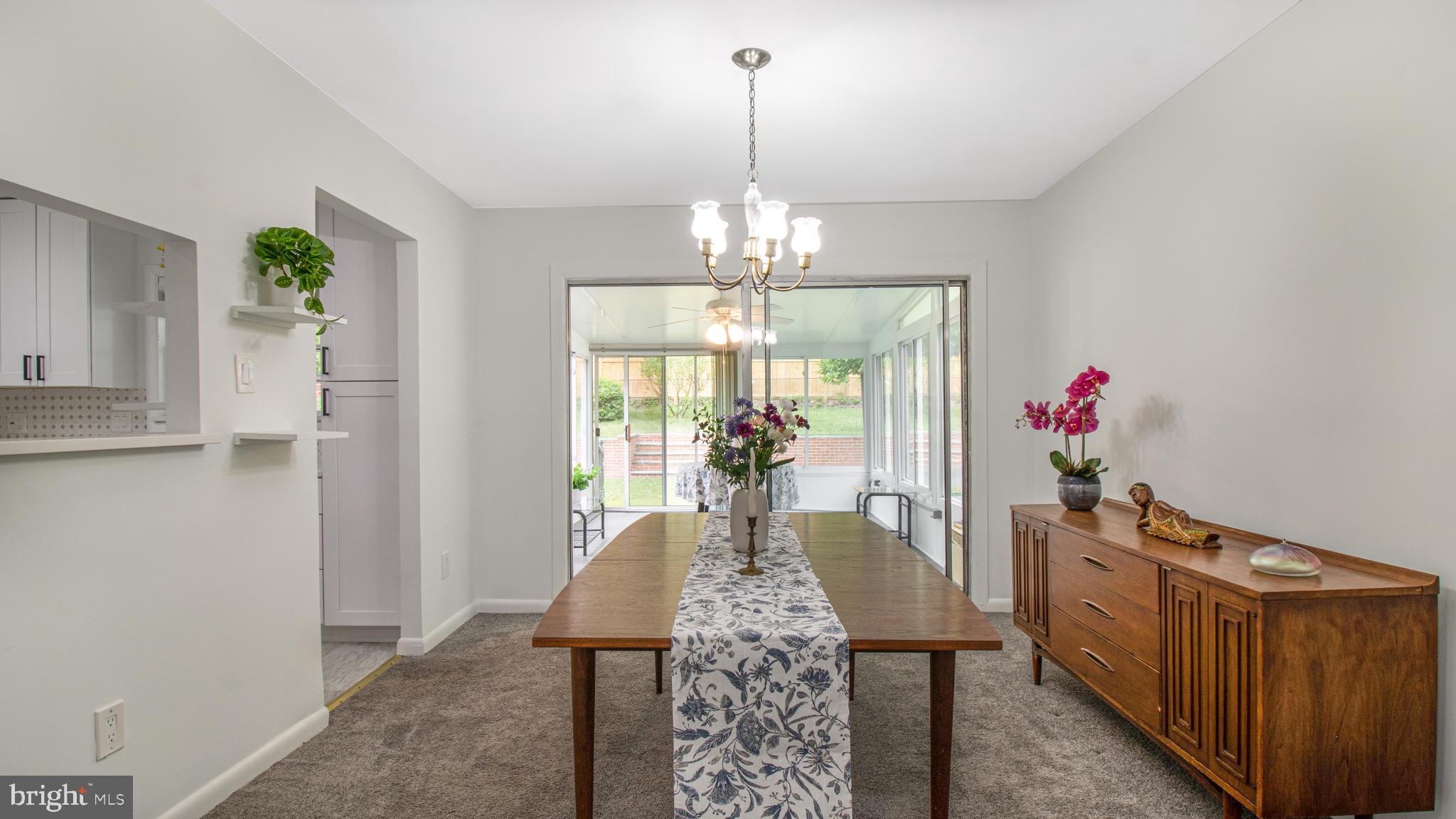 10310 Royal Road Silver Spring, MD 20903 - Photo 9 of 61 a view of a dining room with furniture wooden floor and chandelier