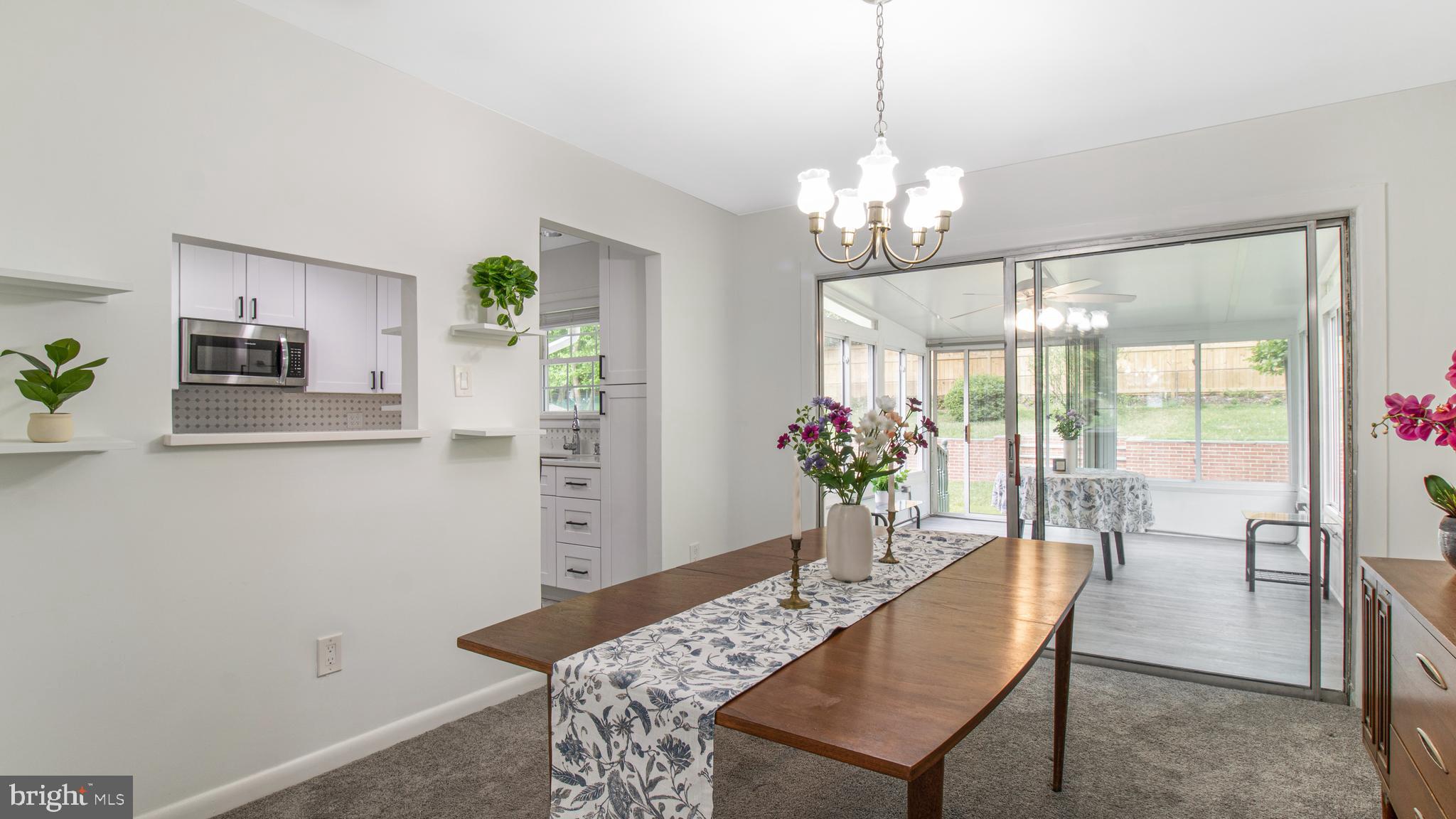 10310 Royal Road Silver Spring, MD 20903 - Photo 10 of 61 a view of a dining room with furniture and chandelier