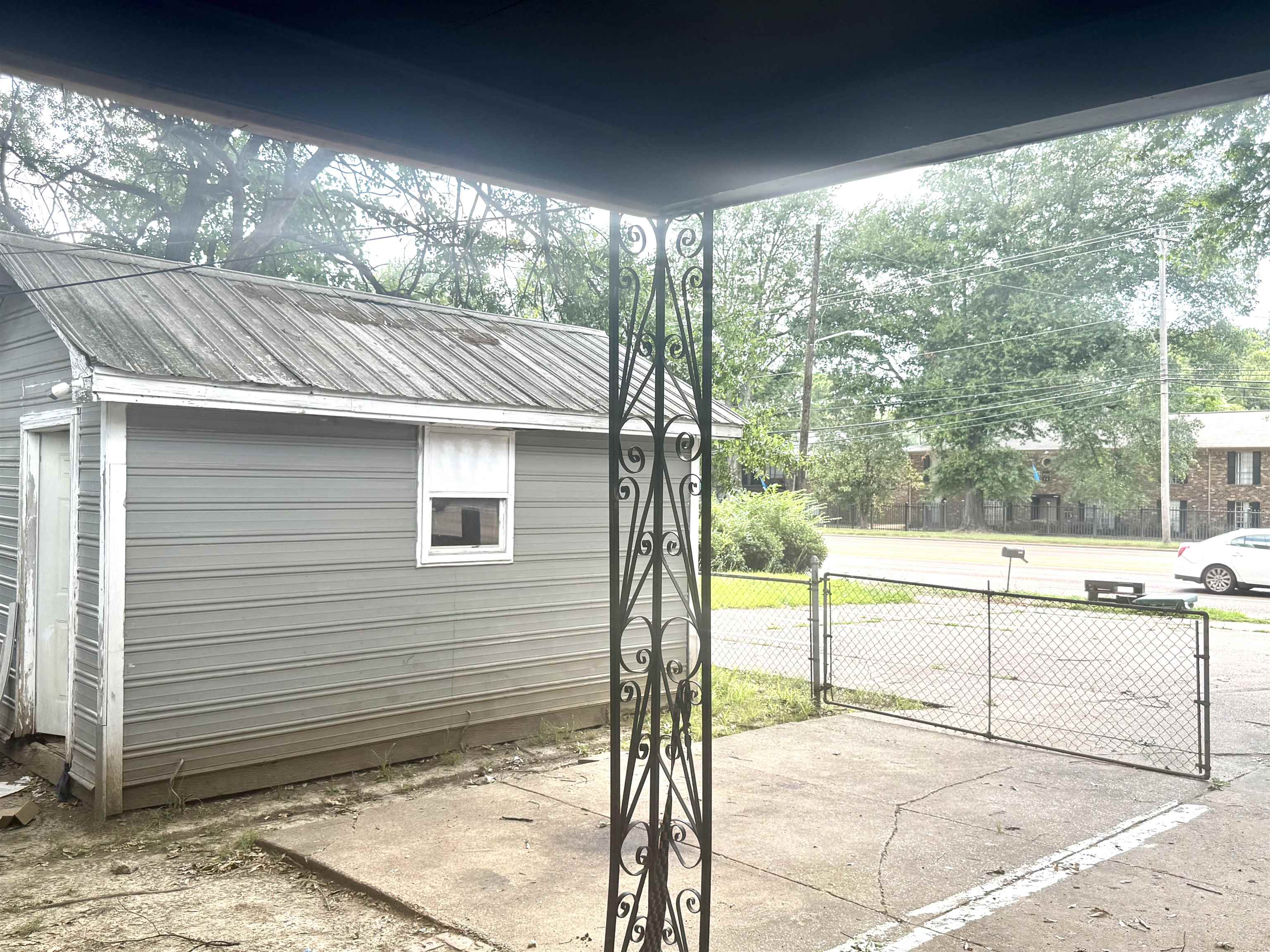 2930 Getwell Road Memphis, TN 38118 - Photo 25 of 25 Detached utility building with metal roofing, horizontal siding, and a single window