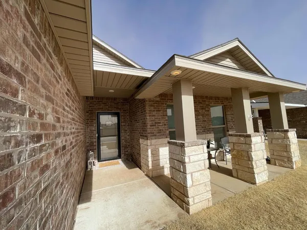 a view of a house with large windows