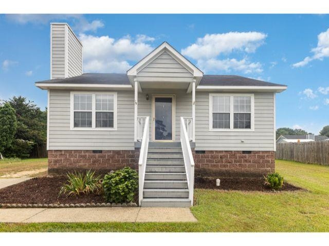 608 Perry Howard Road Fuquay-Varina, NC 27526 - Photo 1 of 21 a front view of a house with a garden