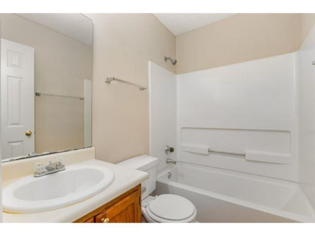 608 Perry Howard Road Fuquay-Varina, NC 27526 - Photo 17 of 21 a bathroom with a sink and a mirror