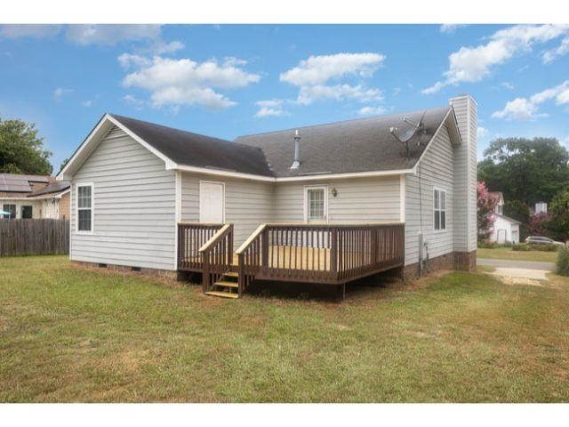 608 Perry Howard Road Fuquay-Varina, NC 27526 - Photo 21 of 21 a view of a house with a backyard