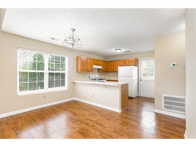 608 Perry Howard Road Fuquay-Varina, NC 27526 - Photo 7 of 21 a view of an empty room with a window