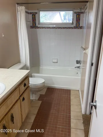 a bathroom with a sink a toilet and a bathtub