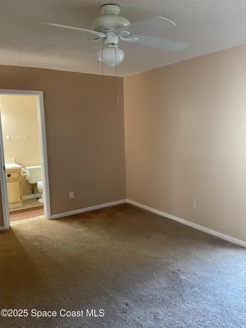 an empty room with a view of a bathroom