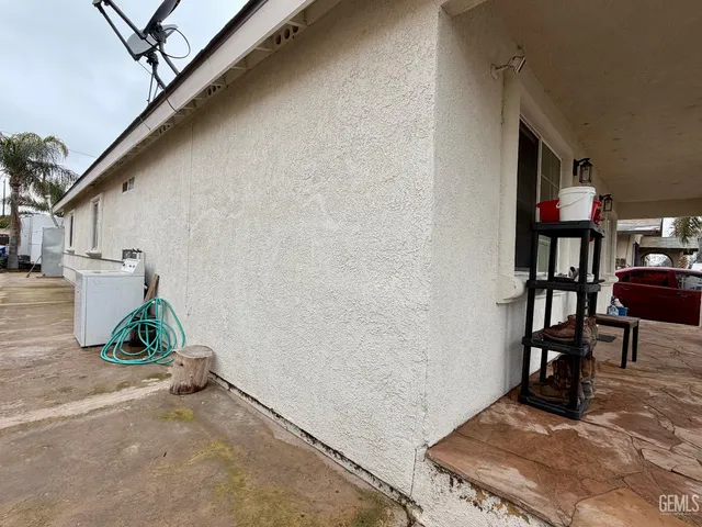 a view of a backyard with a car parked
