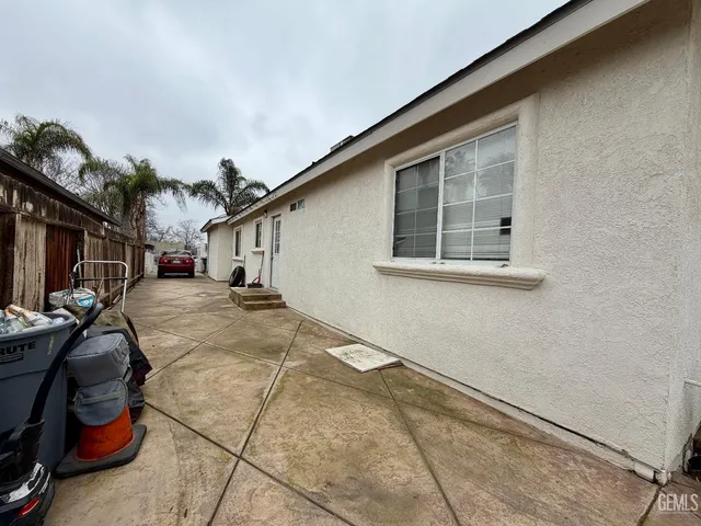 a view of cars parked in front of a house