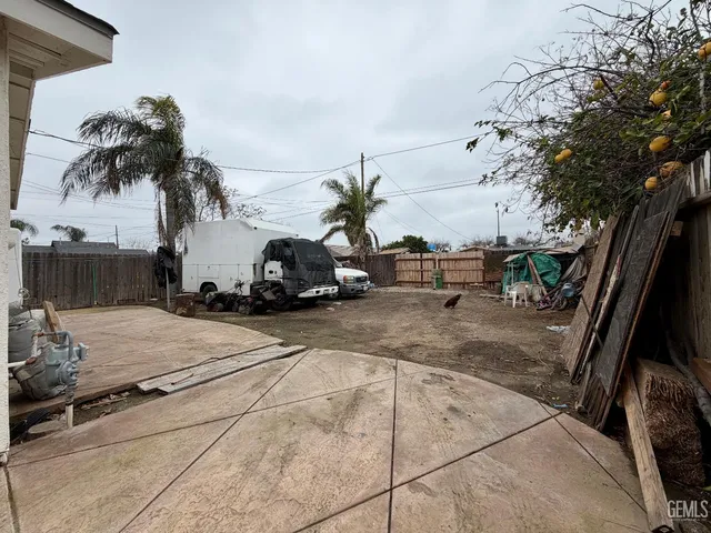 a living room with furniture ceiling fan and a rug