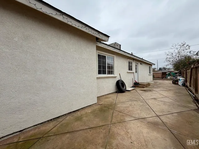 a kitchen with wooden cabinets and a stove top oven