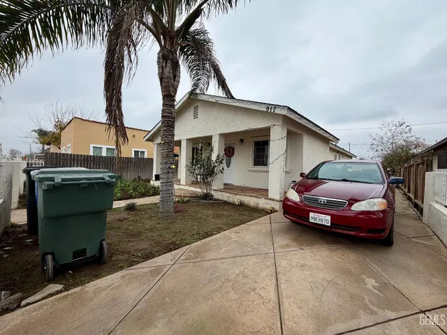a kitchen with stainless steel appliances granite countertop a refrigerator a stove a sink and dishwasher