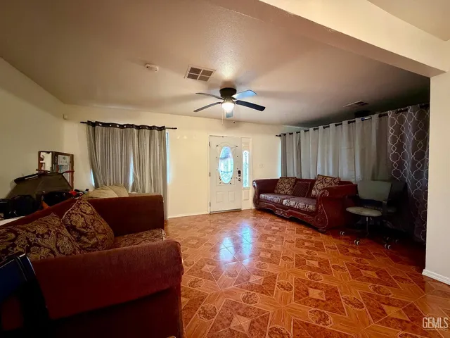 an aerial view of a house with garden space and street view