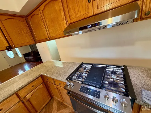 an aerial view of a house with a yard and lake view