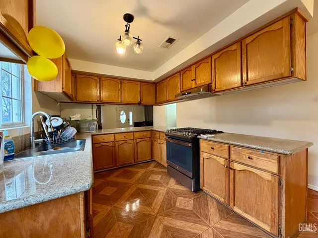 a bathroom with a sink toilet a mirror and bathtub