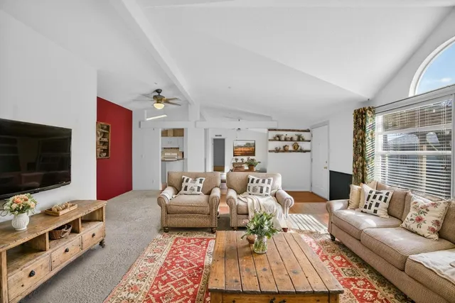 a spacious bedroom with a bed and a window