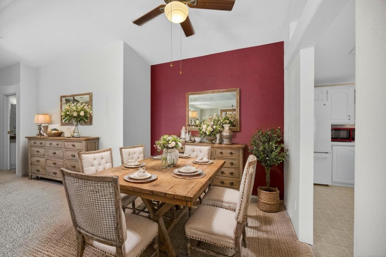 9708 La Clair Road Wilton, CA 95693 - Photo 15 of 60 a view of a dining room with furniture and wooden floor