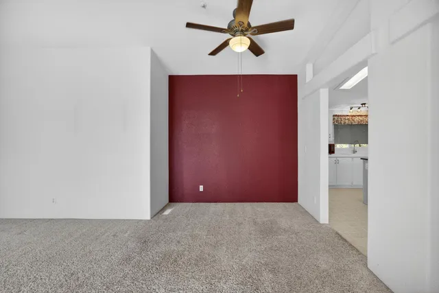 a view of a kitchen with a sink and a window