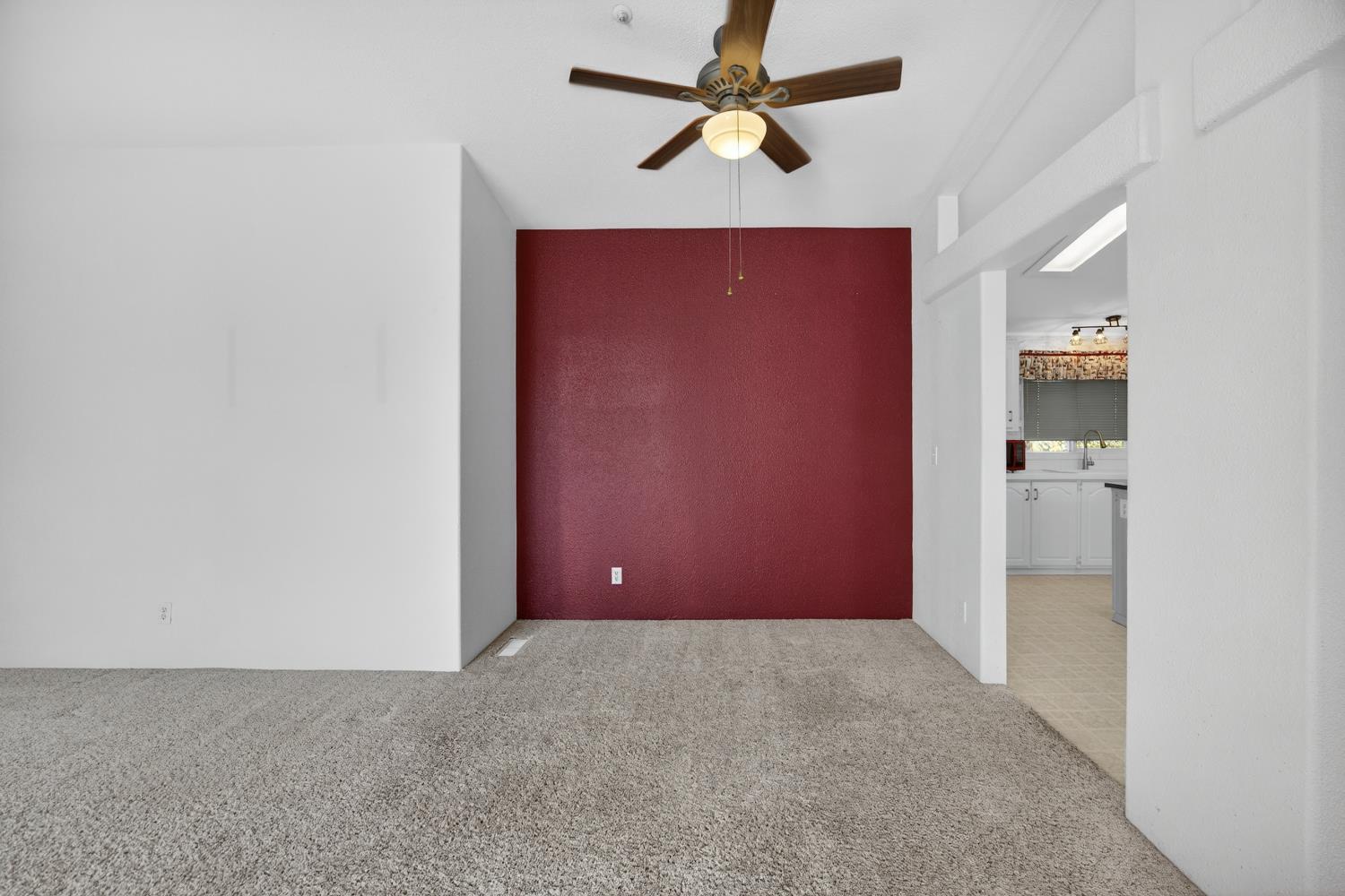 9708 La Clair Road Wilton, CA 95693 - Photo 16 of 60 a view of a big room with closet and a chandelier fan