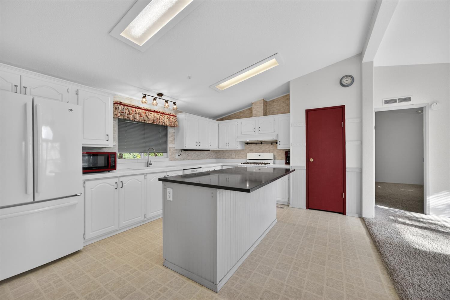 9708 La Clair Road Wilton, CA 95693 - Photo 22 of 60 a kitchen with stainless steel appliances granite countertop a refrigerator and a sink