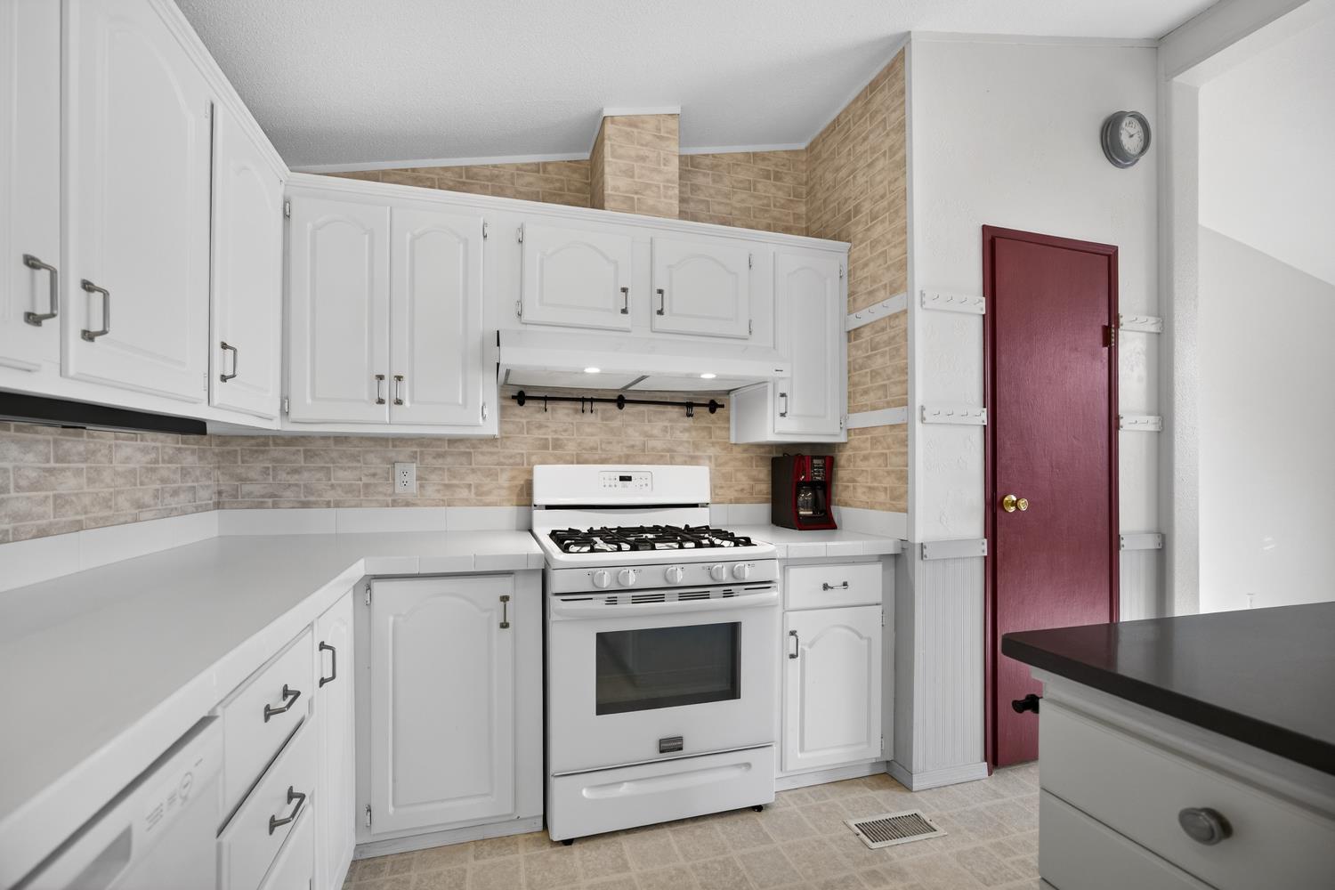 9708 La Clair Road Wilton, CA 95693 - Photo 24 of 60 a kitchen with cabinets appliances and a sink