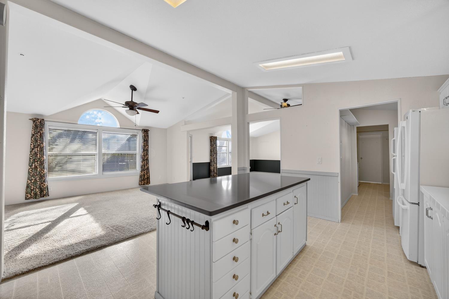 9708 La Clair Road Wilton, CA 95693 - Photo 25 of 60 a kitchen with granite countertop a sink and a refrigerator