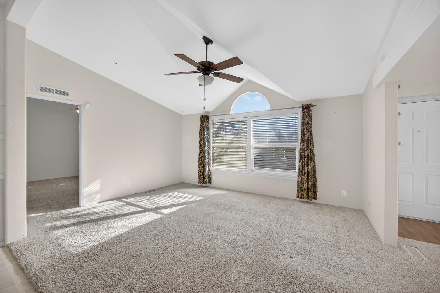 9708 La Clair Road Wilton, CA 95693 - Photo 26 of 60 a view of a room with a ceiling fan and window