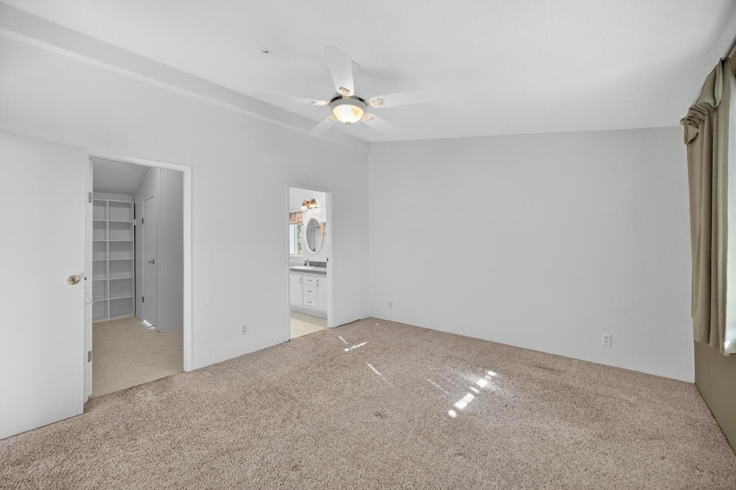 9708 La Clair Road Wilton, CA 95693 - Photo 29 of 60 a view of an empty room with a ceiling fan