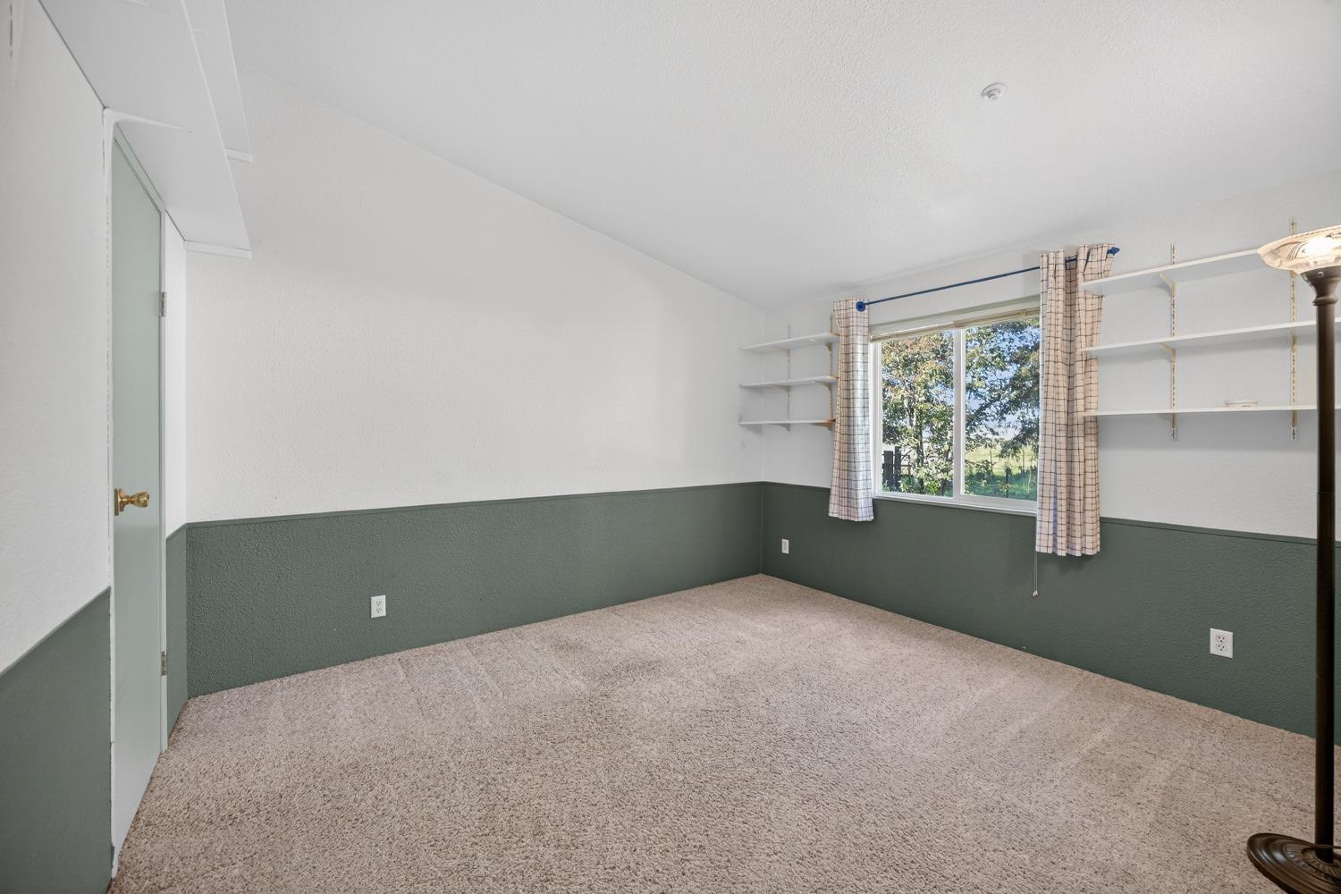 9708 La Clair Road Wilton, CA 95693 - Photo 36 of 60 a view of an empty room with a window