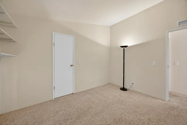 a bathroom with a granite countertop sink toilet a mirror a bathtub and shower