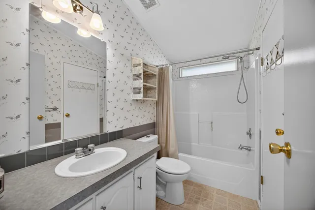 a hallway with sink and window