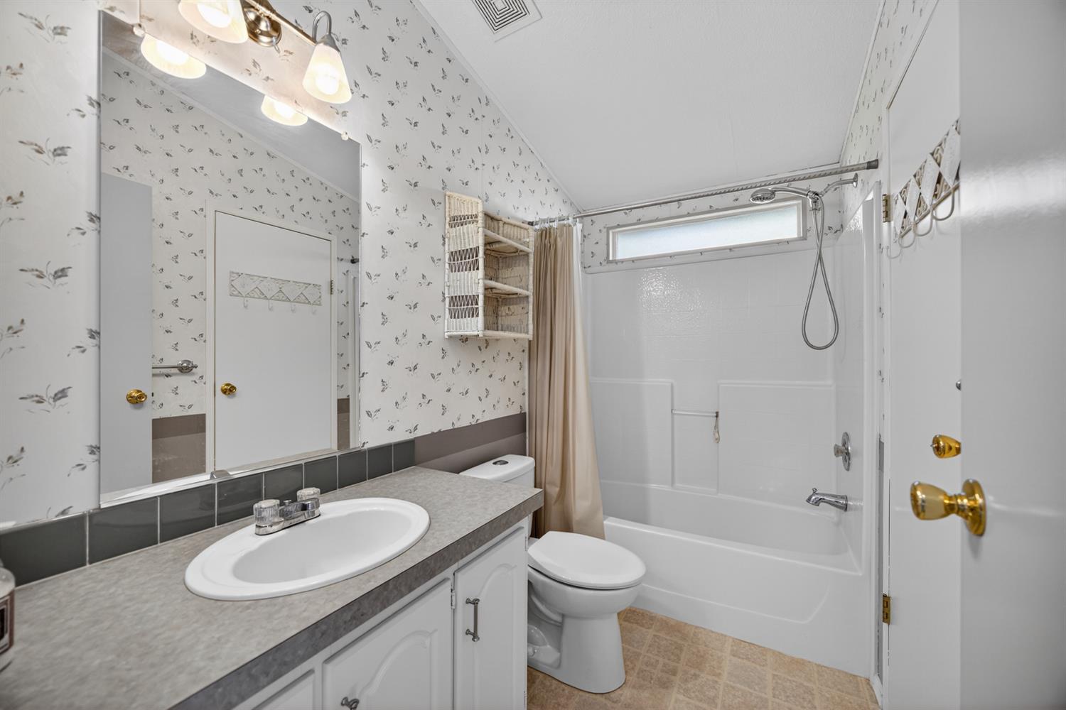 9708 La Clair Road Wilton, CA 95693 - Photo 39 of 60 a bathroom with a sink a toilet and shower