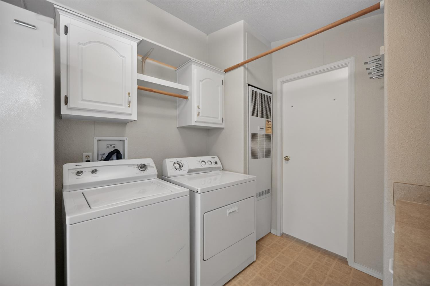 9708 La Clair Road Wilton, CA 95693 - Photo 43 of 60 a view of storage and utility room with washer and dryer