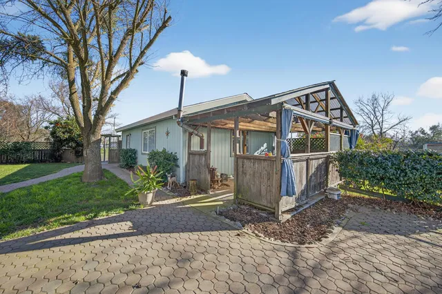 a view of a backyard with a garden and plants