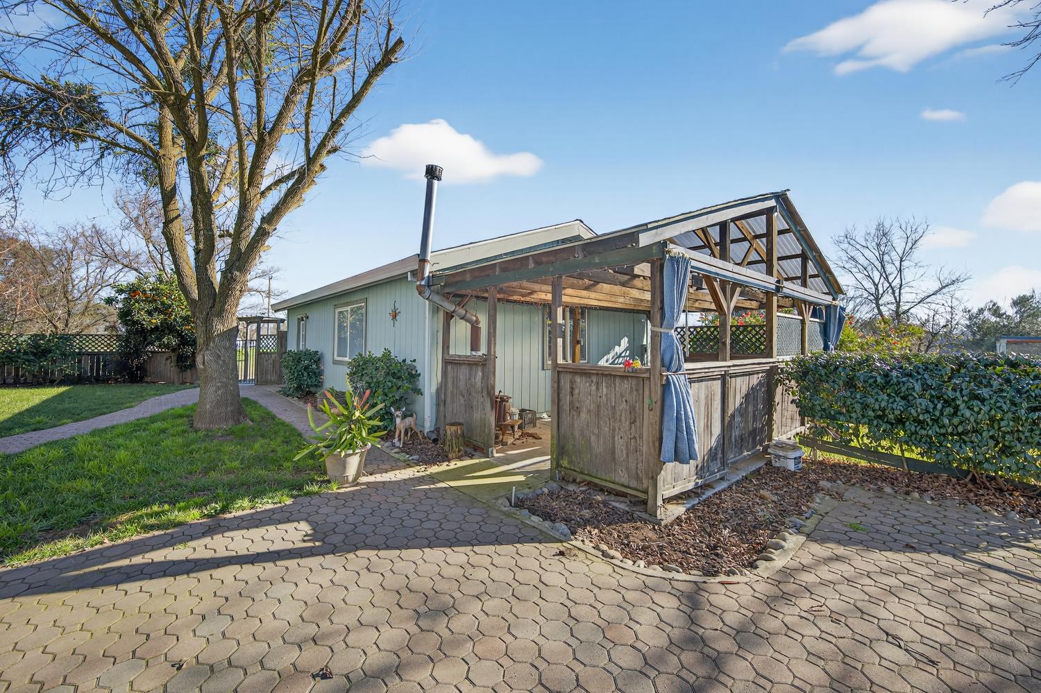 9708 La Clair Road Wilton, CA 95693 - Photo 44 of 60 a front view of a house with garden