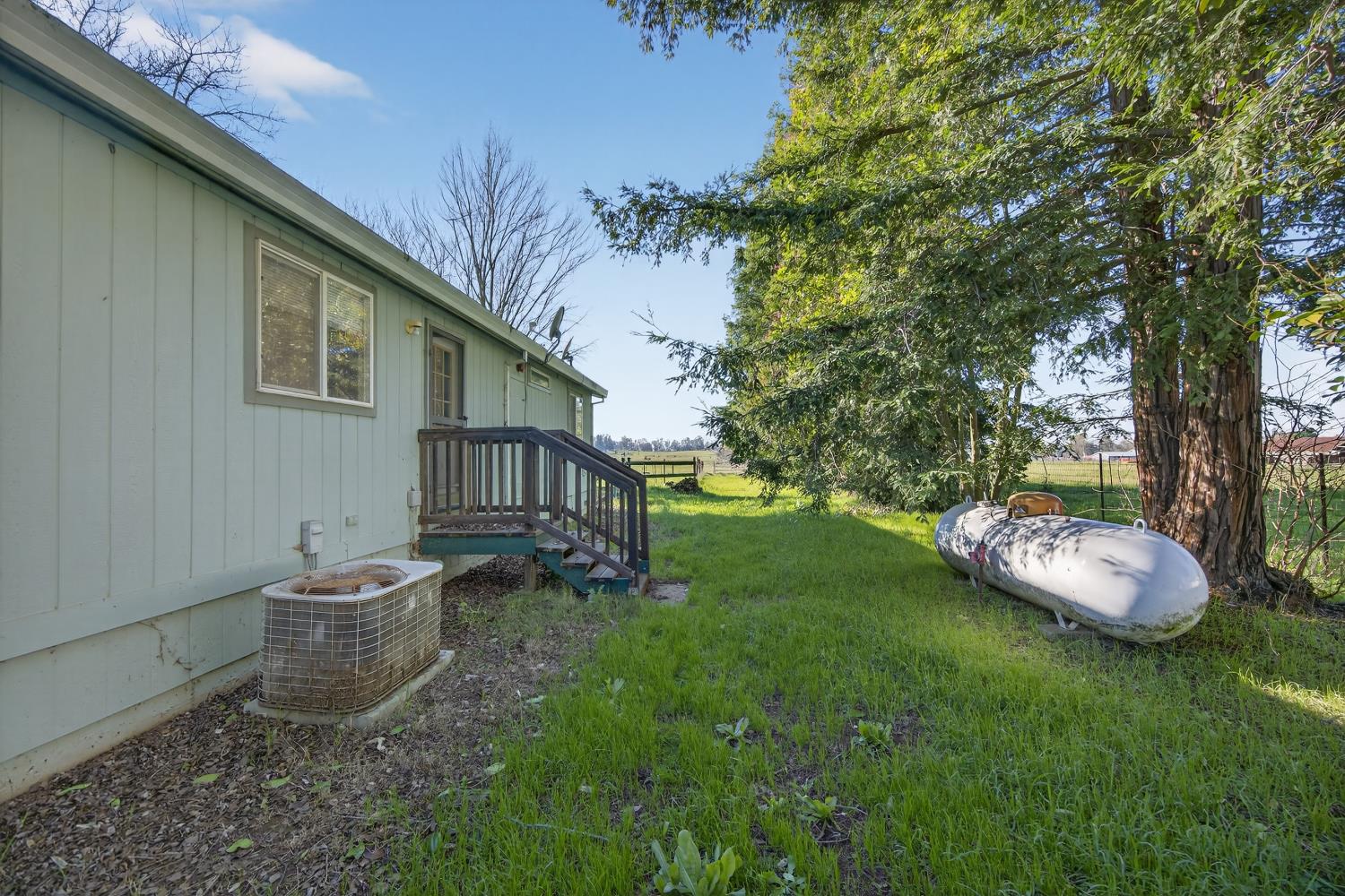 9708 La Clair Road Wilton, CA 95693 - Photo 46 of 60 a view of a backyard with a garden and plants