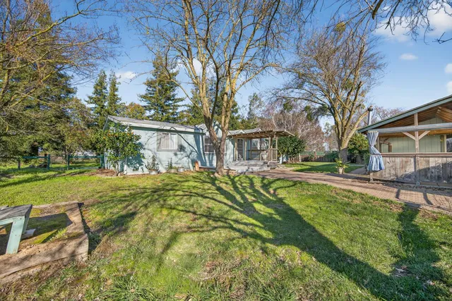 a backyard of a house with lots of green space