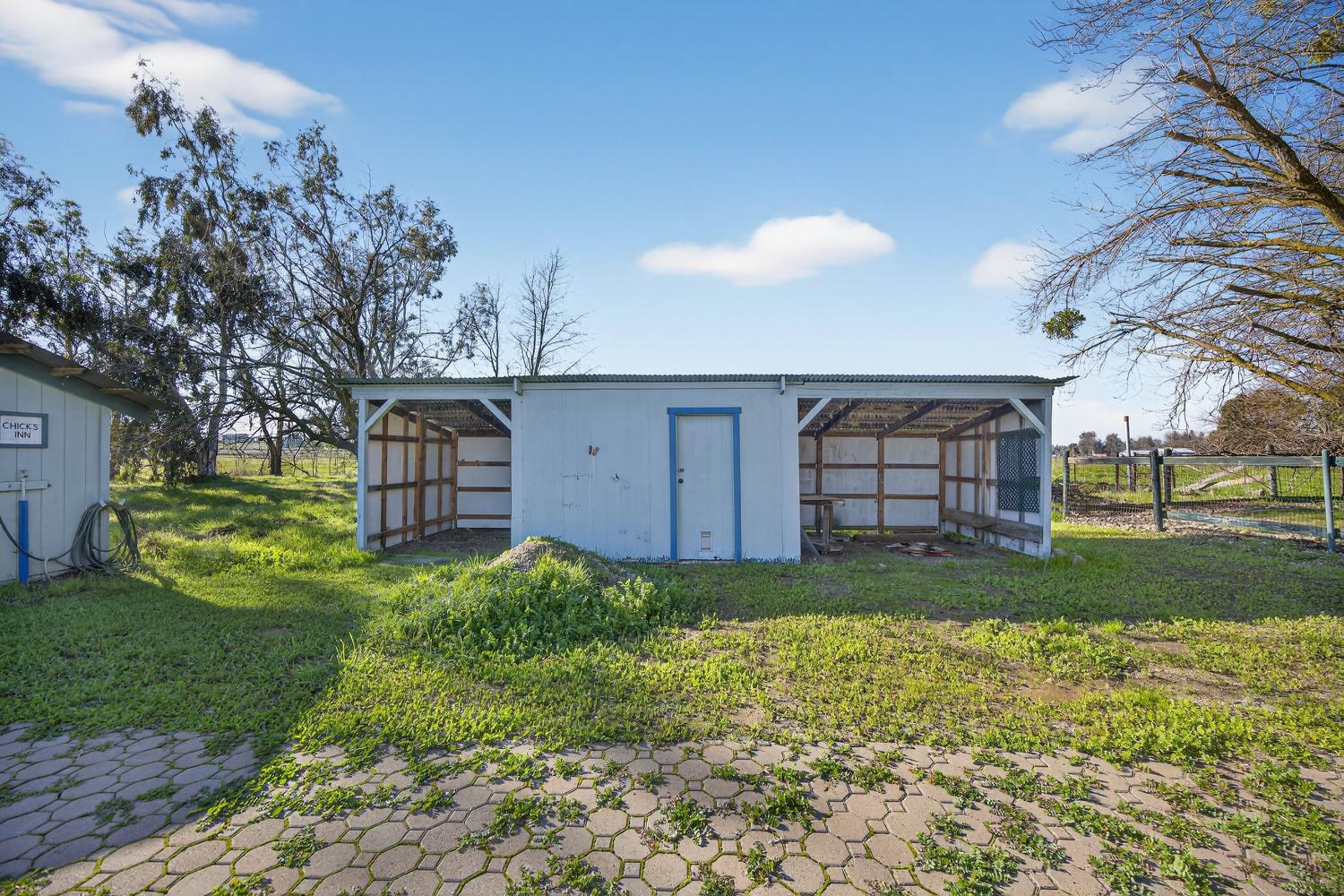 9708 La Clair Road Wilton, CA 95693 - Photo 48 of 60 a view of a backyard with large trees