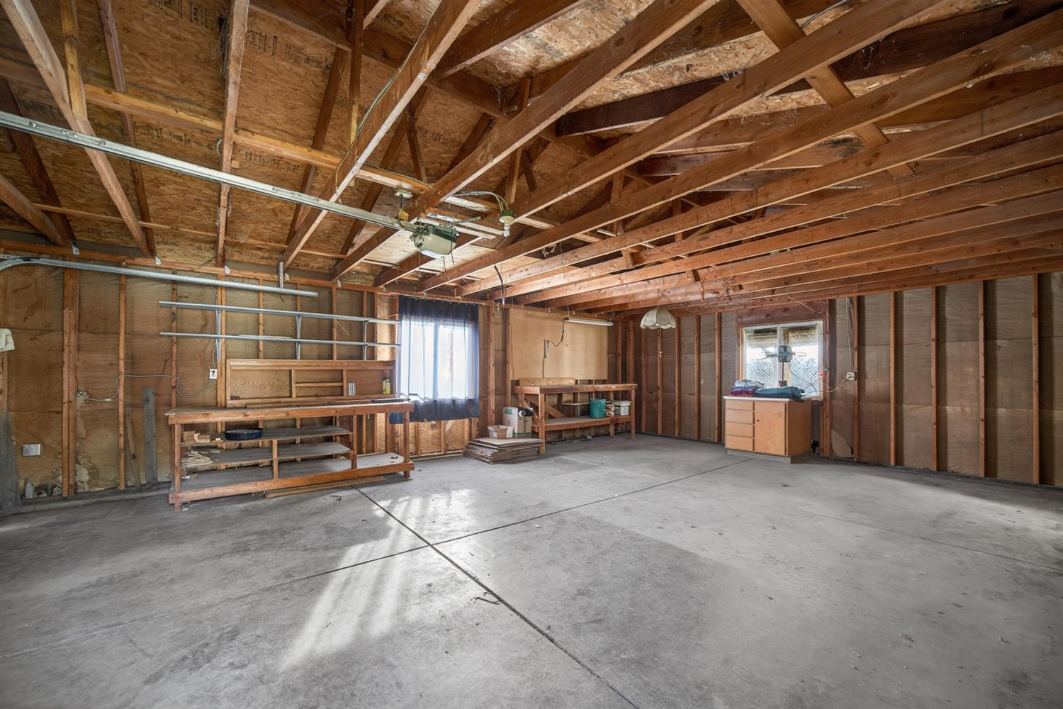 9708 La Clair Road Wilton, CA 95693 - Photo 53 of 60 a view of a room with wooden shelves