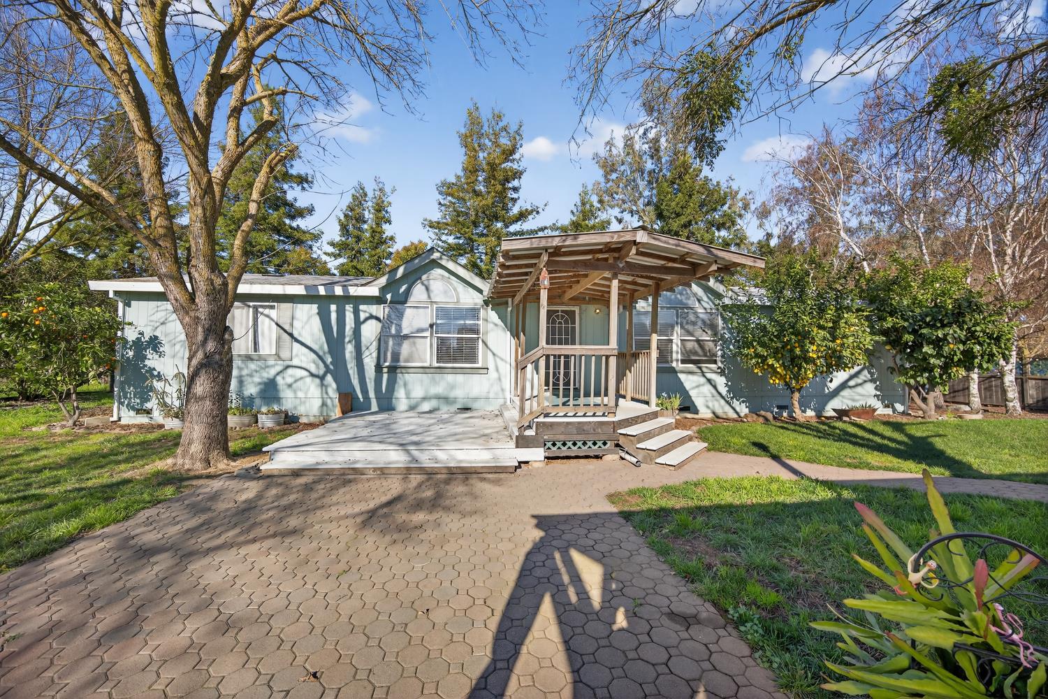 9708 La Clair Road Wilton, CA 95693 - Photo 7 of 60 a view of a house with a yard