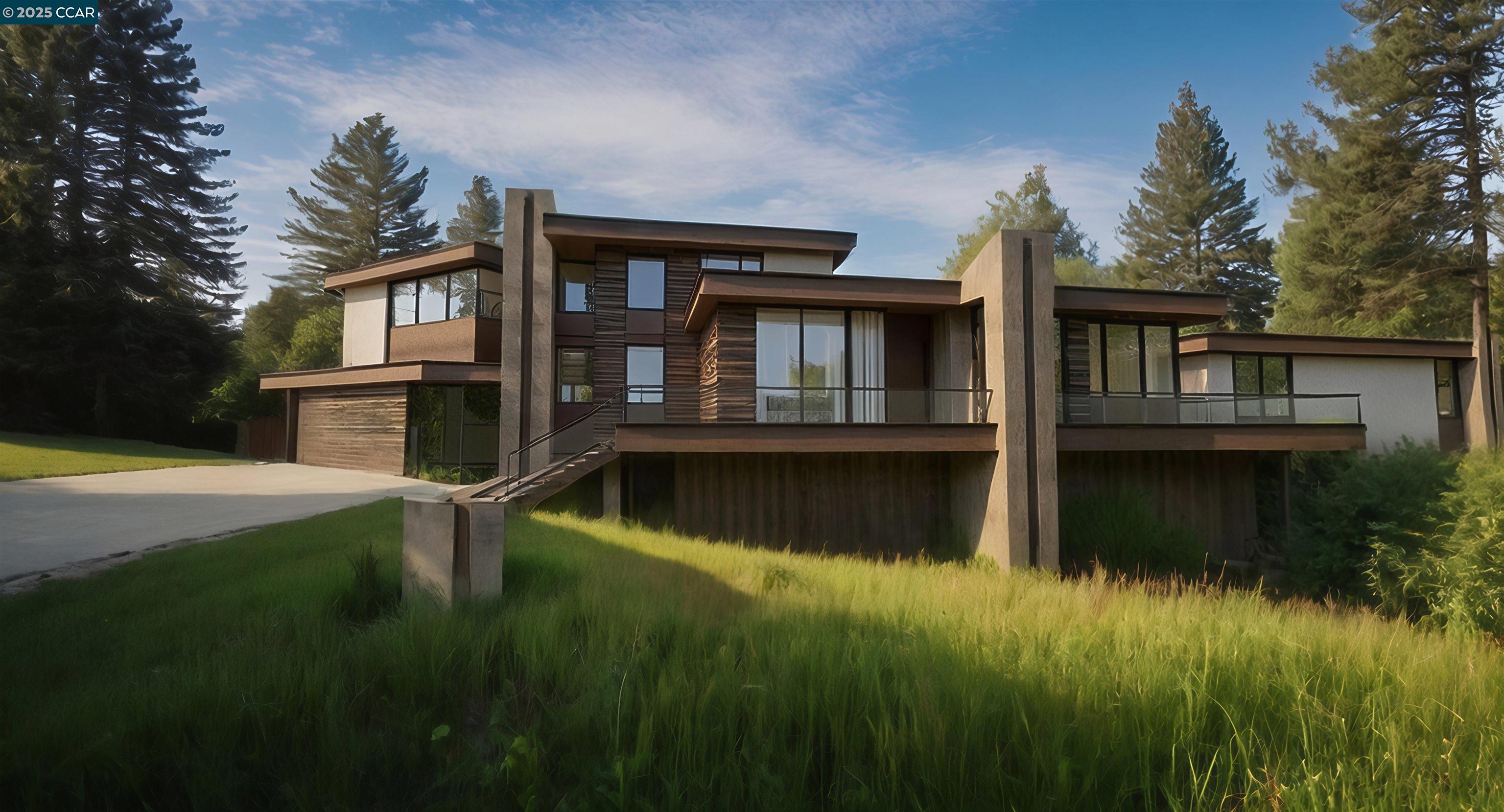 a view of a house with a yard from a lake view