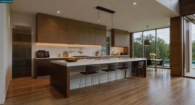 a kitchen with a sink a counter top space and stainless steel appliances